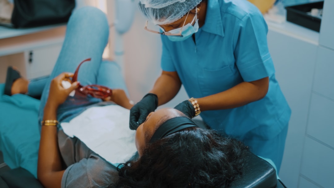 Gentle dentist interacting warmly with a happy child patient